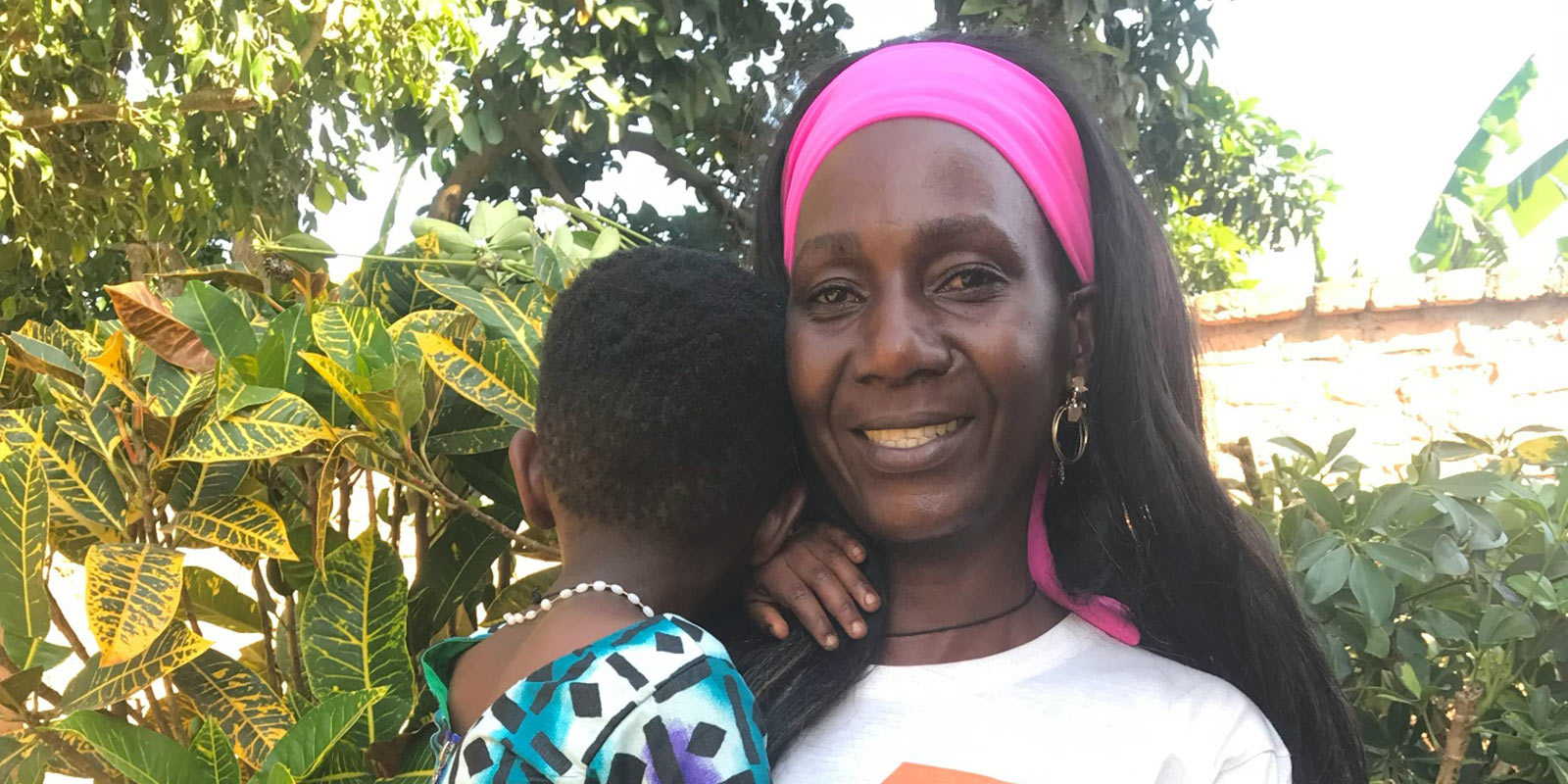 Adoptive mom Grace holds her 7-year-old daughter, Natalie, adopted domestically in Uganda