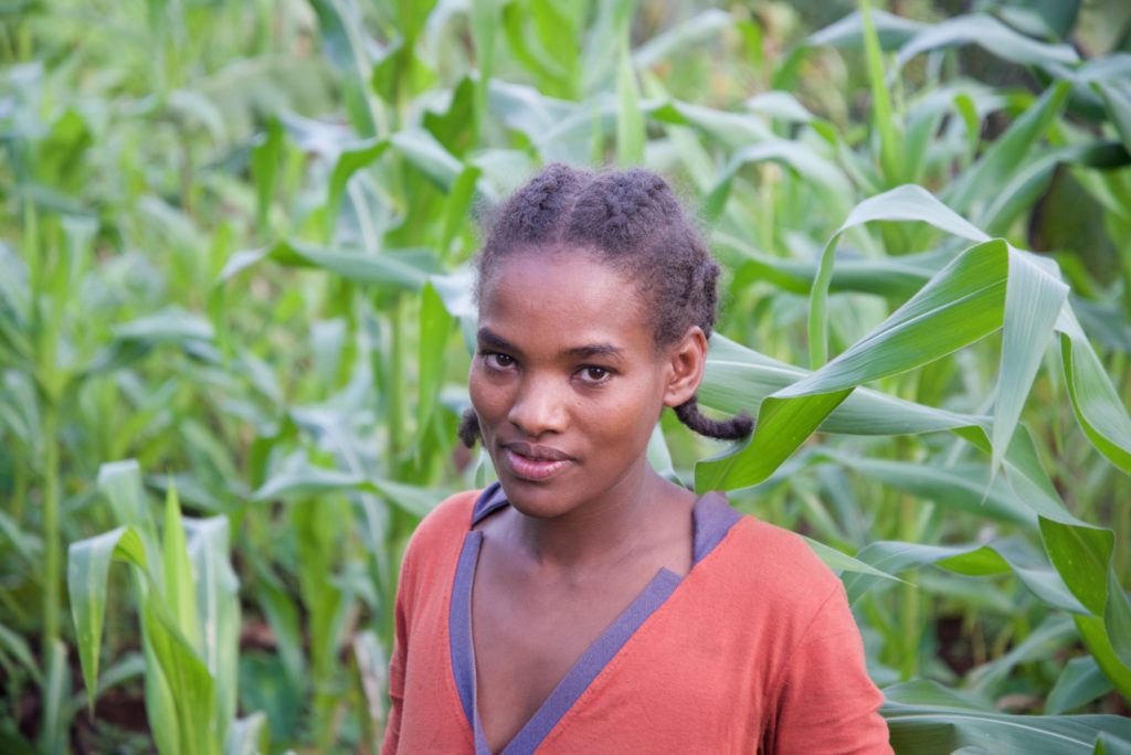 Meselech standing in her garden.