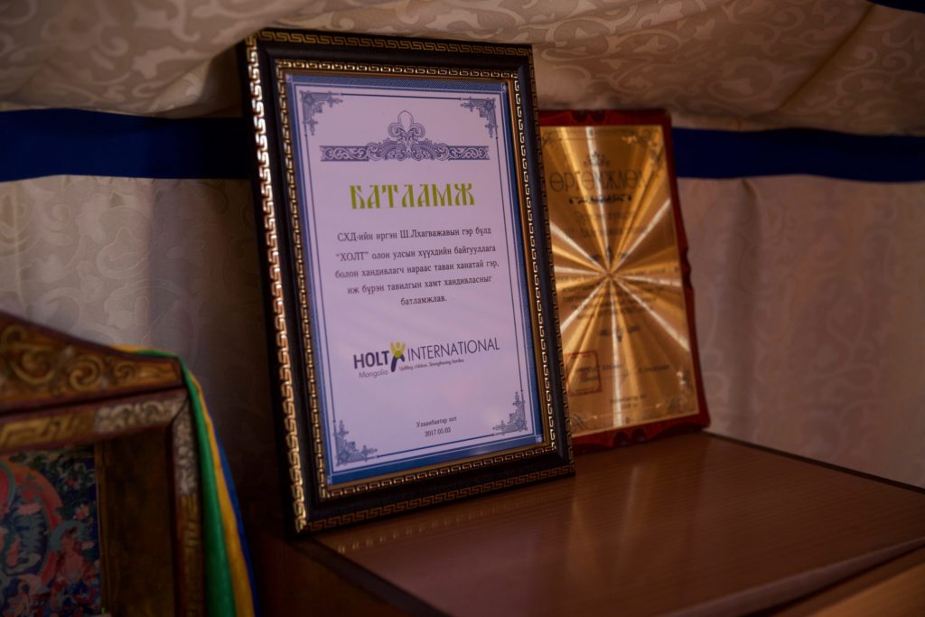 After receiving a ger as a Gift of Hope, the family displayed their certificates of ownership inside their new home.
